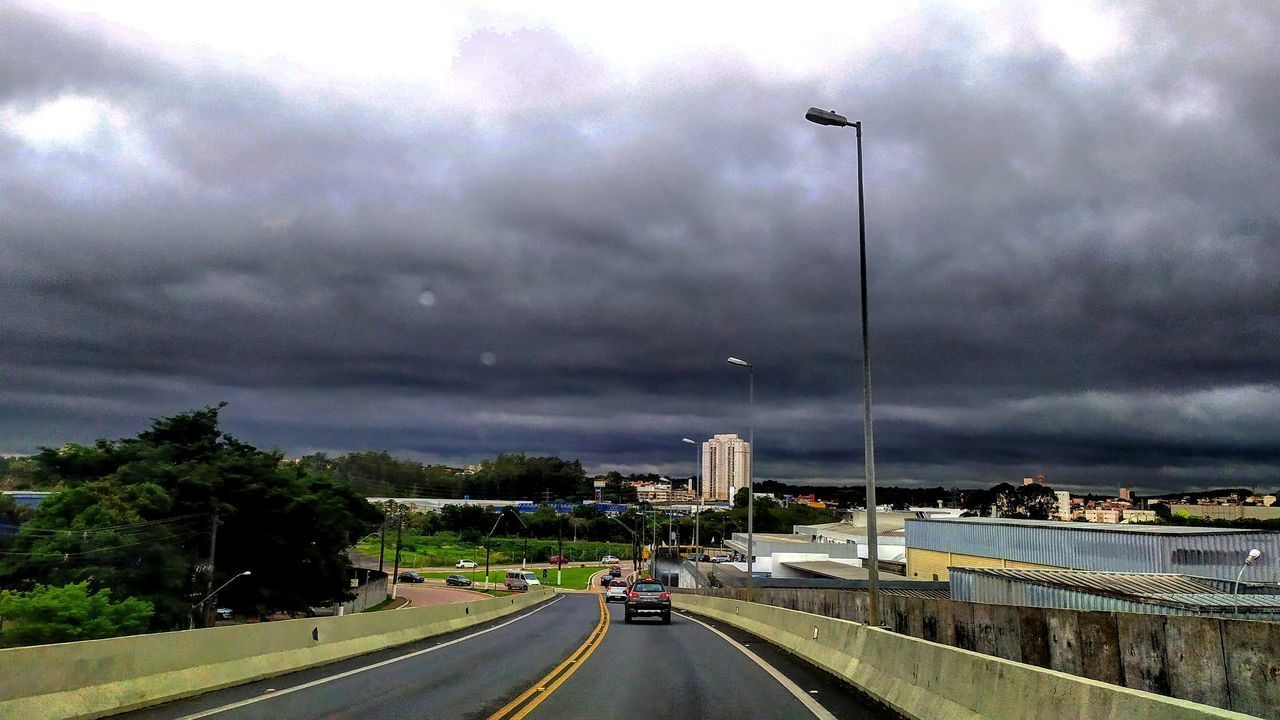 CARS ON HIGHWAY IN CITY