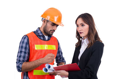 Men working against white background