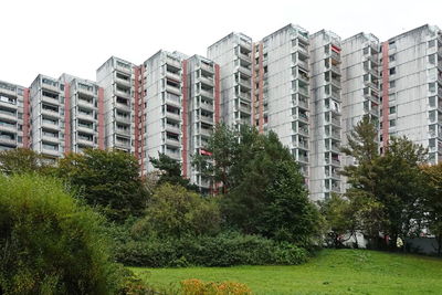 Buildings in city against clear sky