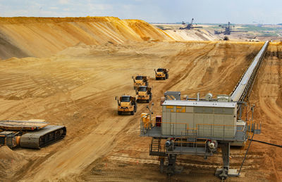 High angle view of vehicles on road along landscape