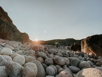 Scenic view of rocks against clear sky