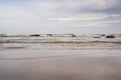 Scenic view of beach against sky