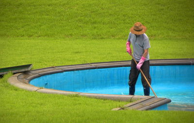 Woman standing in swimming pool