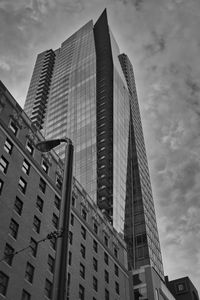 Low angle view of modern buildings against sky in city