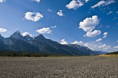 Scenic view of mountains against cloudy sky