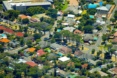 High angle view of houses and trees in town