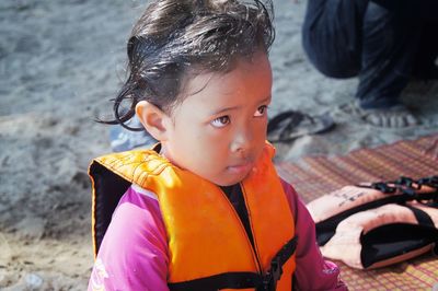 Portrait of cute baby girl on beach