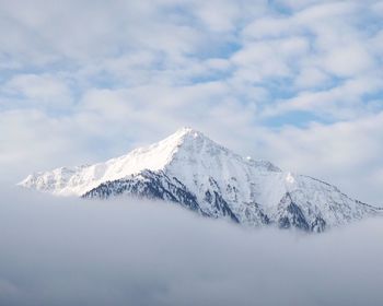 Scenic view of snowcapped mountains against sky