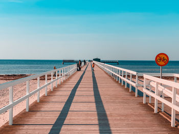 Pier over sea against sky