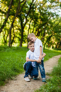 Father and son on plant