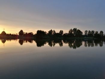 Scenic view of lake against sky during sunset