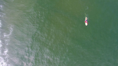 High angle view of person hanging in water