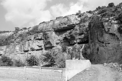 Low angle view of rock formations against sky