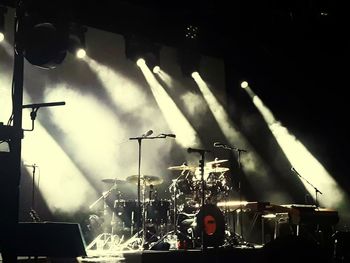 Low angle view of illuminated lighting equipment at home