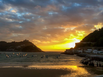 Scenic view of calm sea at sunset