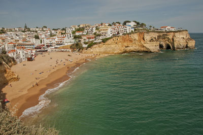 High angle view of townscape by sea