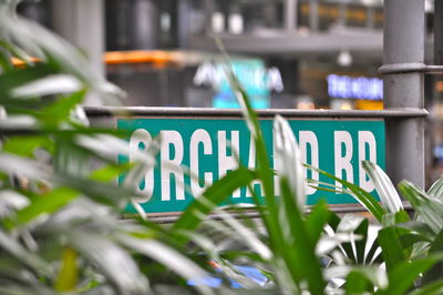 Close-up of information sign board in city