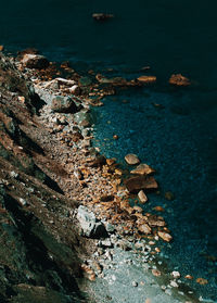 High angle view of sea and rocks