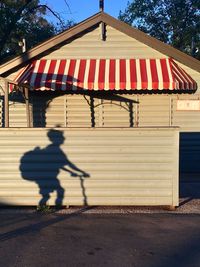 Shadows from yesteryear, in the park, child with backpack on a scooter