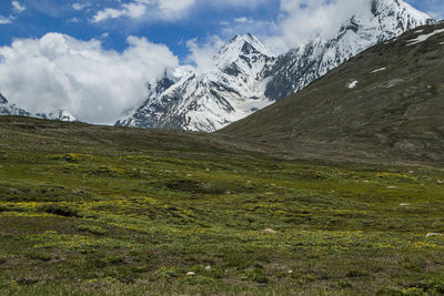 Scenic view of snowcapped mountains against sky