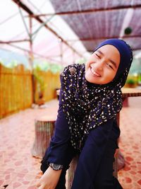 Full length of smiling girl looking away
