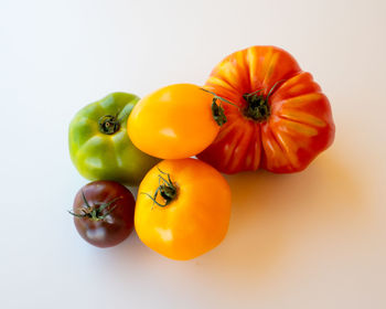 Close-up of oranges against white background