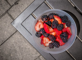 High angle view of fresh berries in plate on table