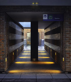 Illuminated corridor leading towards subway station