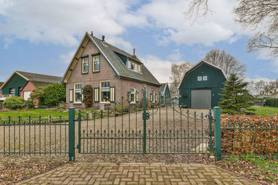 House on field against sky