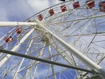 Low angle view of ferris wheel against sky