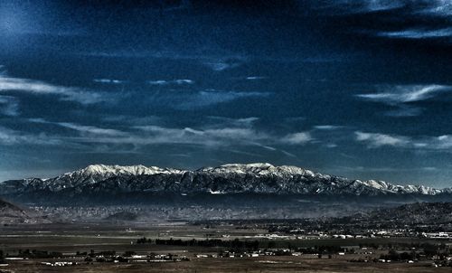 Scenic view of snow covered landscape against sky