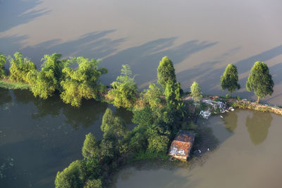 High angle view of plants by lake against sky