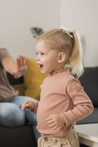 Portrait of cute baby girl at home