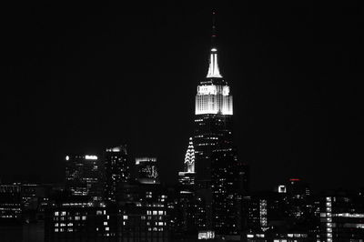 Low angle view of skyscrapers lit up at night