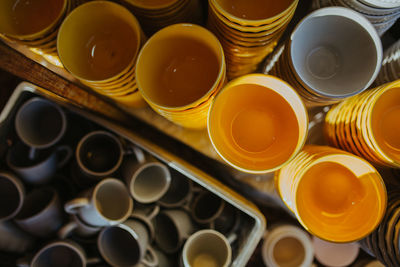 High angle view of various pottery cups