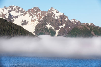 Clouds rolling from the mountains in the ocean