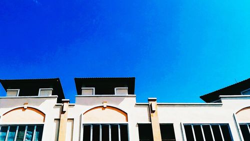 Low angle view of building against blue sky