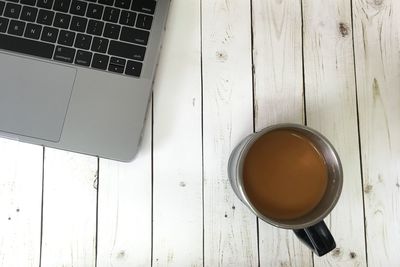 High angle view of coffee cup on table