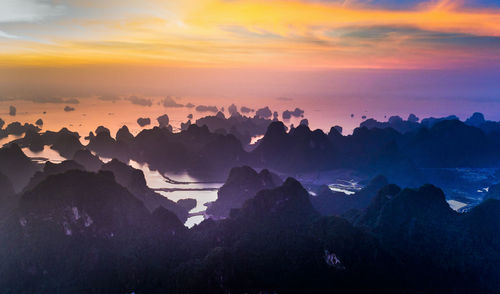 Scenic view of silhouette mountain against sky during sunset