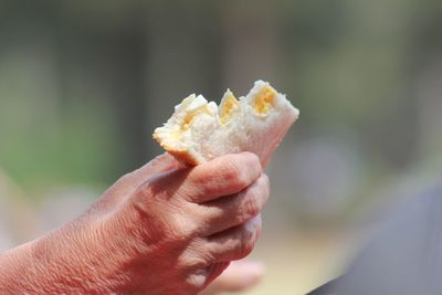 Close-up of hand holding ice cream