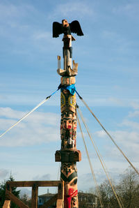 Reconciliation totem being raised by the people
