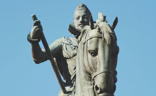 Low angle view of statue against sky