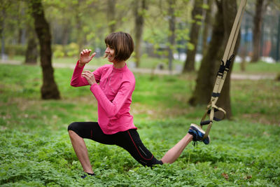 Mid adult woman exercising at park