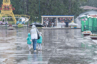 People on wet street in rain