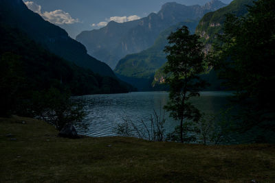 Scenic view of lake and mountains against sky