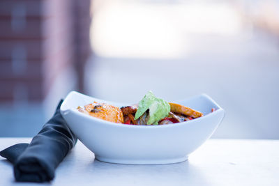 Close-up of salad in bowl on table