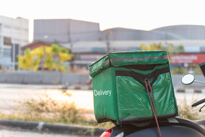 Rear view of man with umbrella on street