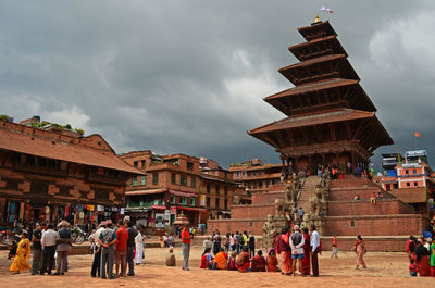 People walking in front of building