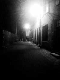 Illuminated city street at night