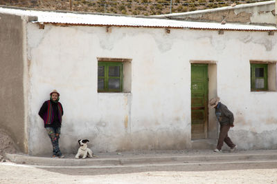 Full length of dog on building